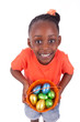 African girl holding chocolate ester egg