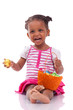 African Girl Holding Chocolate...