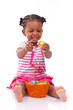 African Girl Holding Chocolate...