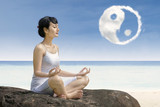 Attractive girl at beach exercise yoga at beach