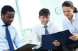 Business partners with clipboards