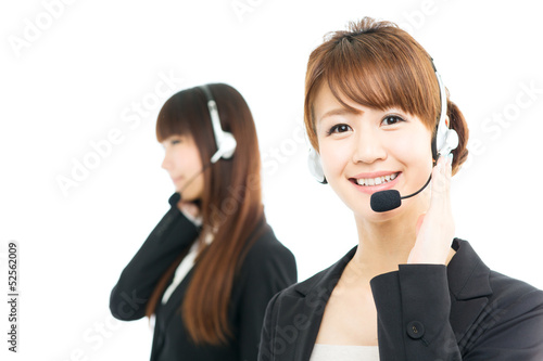 Photo: Beautiful asian business operator isolated on white background Beautiful asian business operator isolated on white background