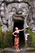 Photo: Young woman standing in the demon mouth at Goa Gajah Young woman standing in the demon mouth at Goa Gajah