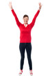 Photo: Joyous female raising arms in excitement Joyous female raising arms in excitement