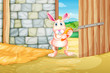 A bunny holding a carrot inside the barn