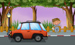 A boy with his tools near the orange vehicle