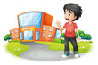 A boy standing in front of the school