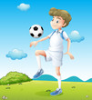 A boy playing soccer during daytime