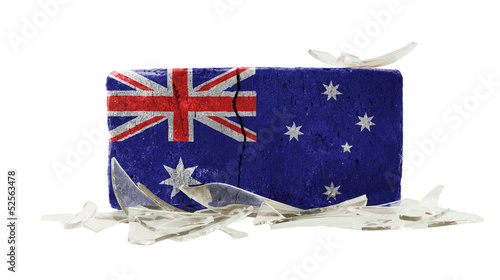 Photo: Brick with broken glass, violence concept Brick with broken glass, violence concept