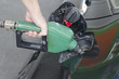 Closeup of man pumping gasoline