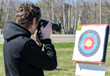 Photo: Photographer with SLR camera aims Photographer with SLR camera aims
