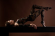 woman lies on a bench