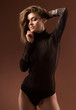 Fashion girl posing on dark background - portrait