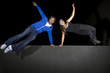 free runner doing parkour at night on a rooftop