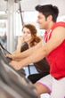 Photo: Man is doing workout on a bicycle at the gym Man is doing workout on a bicycle at the gym