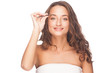 Woman plucking eyebrows