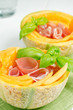 Two melons with ham prosciutto