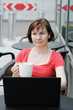 Woman drinking coffee in a outdoor cafe