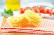 raw pasta and tomato