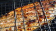 Fish trout on the grill. Summer barbecue concept. Close up with 