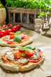 Closeup of fresh ingredients for a mini pizza with mushrooms