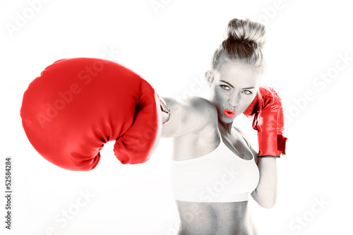 Photo: Sexy woman delivering a punch Sexy woman delivering a punch