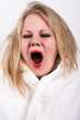 yawning very tired young woman