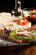 Sandwiches with cheese, ham and lettuce. Dark tone