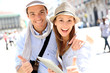 Couple with tablet showing thumbs up