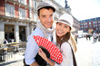 Cheerful couple enjoying tour in Madrid