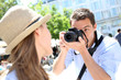 Man taking picture of girlfriend during week-end