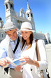 Tourists standing by the Almudena Cathedral of Madrid