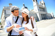 Tourists standing by the Almudena Cathedral of Madrid