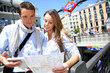 Couple of tourists in Madrid at subway entrance