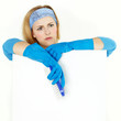 Stressed out cleaning woman presenting white message board