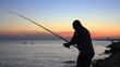 Fisherman silhouette at sunset