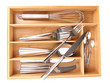 Wooden cutlery box with checked cutlery isolated on white