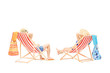 Couple relaxing on a sun loungers