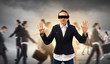 Businesswoman in blindfold among group of people
