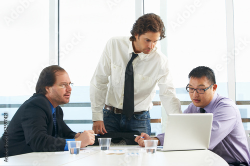 Photo: Group Of Businessmen Meeting In Office Group Of Businessmen Meeting In Office