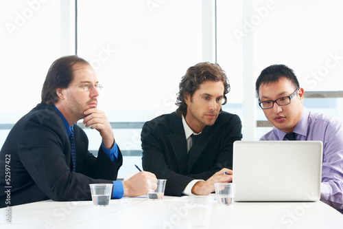 Photo: Group Of Businessmen Meeting In Office Group Of Businessmen Meeting In Office