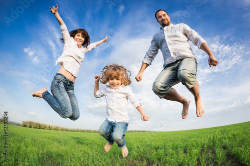 Photo: Happy active family jumping Happy active family jumping