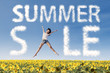 Summer sale clouds and woman jumping over sunflowers