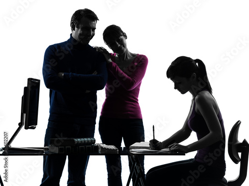 Photo: family father mother proud satisfaction daughter homework silho family father mother proud satisfaction daughter homework silho