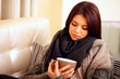 woman in cozy warm clothings with cup of coffee
