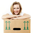 Foto: Pretty young woman rests on her moving box Pretty young woman rests on her moving box