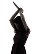 strange young woman killer holding  bloody knife silhouette