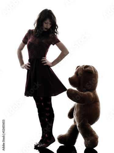 Photo: strange young woman and vicious teddy bear silhouette strange young woman and vicious teddy bear silhouette