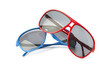 Red and blue sunglasses isolated on white