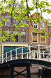 Typical Scene From The Netherlands Of Bikes Over A Canal